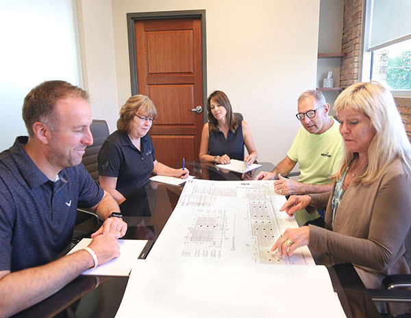 Westwind team reviewing plans with a client